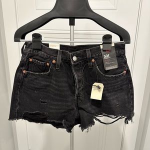 Levi’s 501 black distressed jean shorts